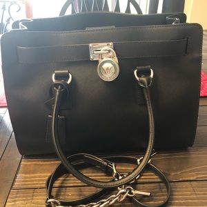 Authentic Micheal Kors purse. Comes with duster.
